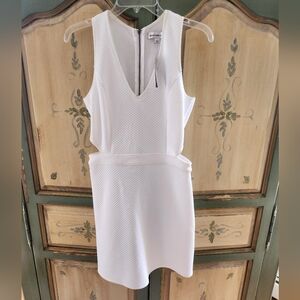 Brand new white tank style dress with cut outs. So cute